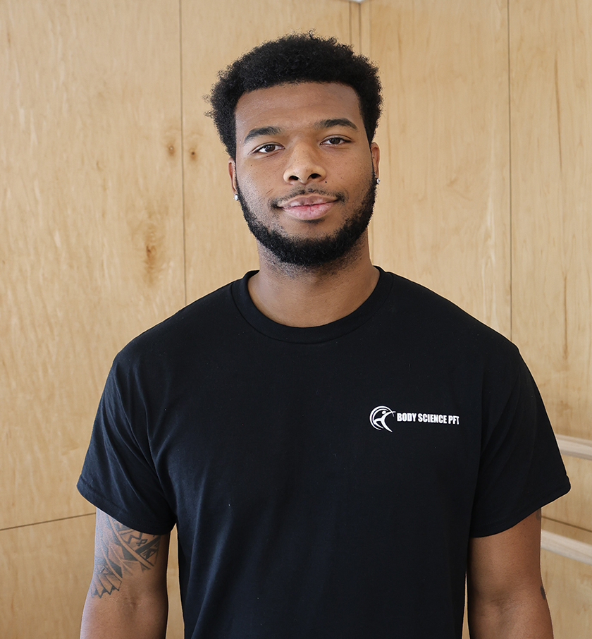 AJ Kulowiyi smiling in his profile headshot